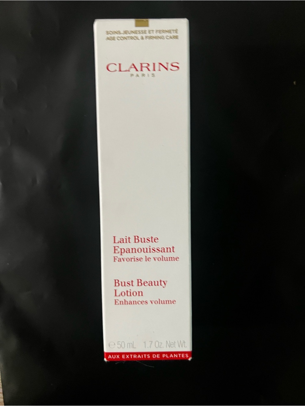 Clarins Bust Beauty Lotion — White with Red Text